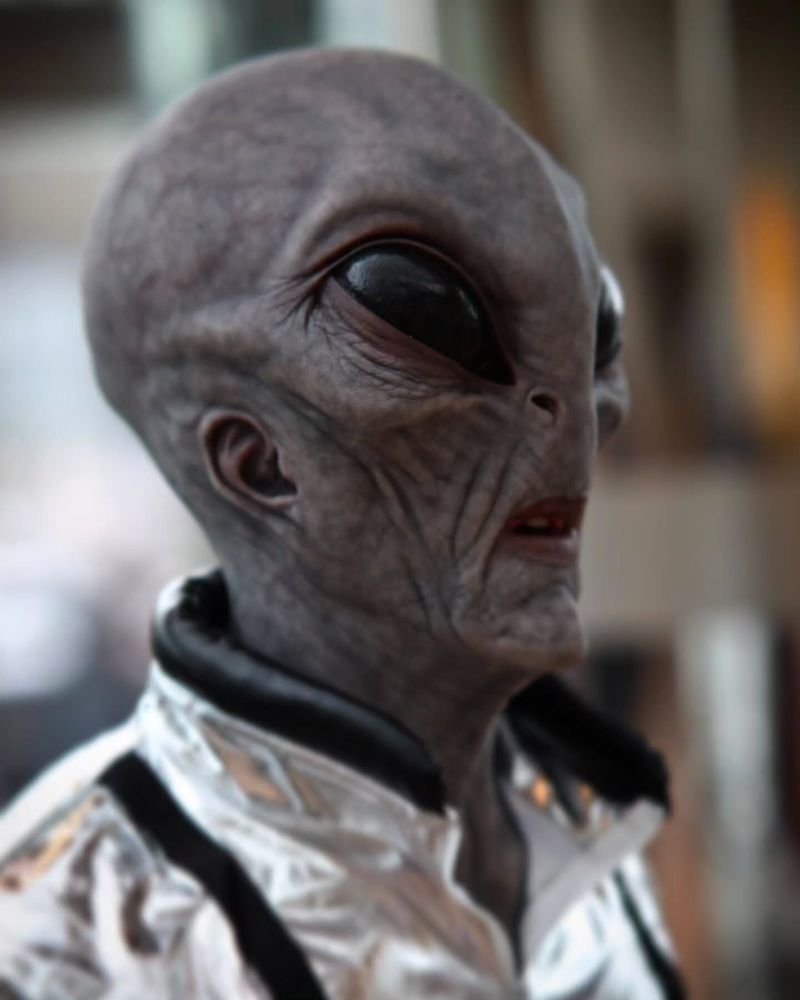 Alien Area 51 mask in a metallic space outfit, captured in cinematic close-up — The Terror Lab.