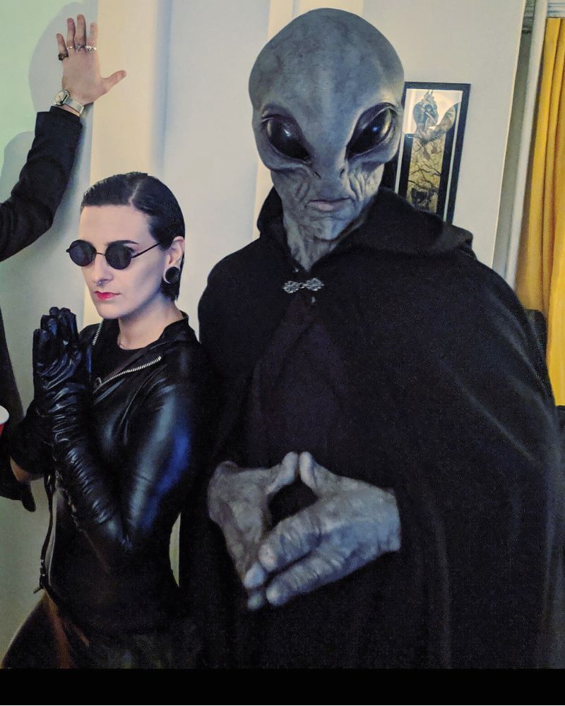Alien Area 51 mask paired with gothic cloak at a Halloween house party – The Terror Lab.