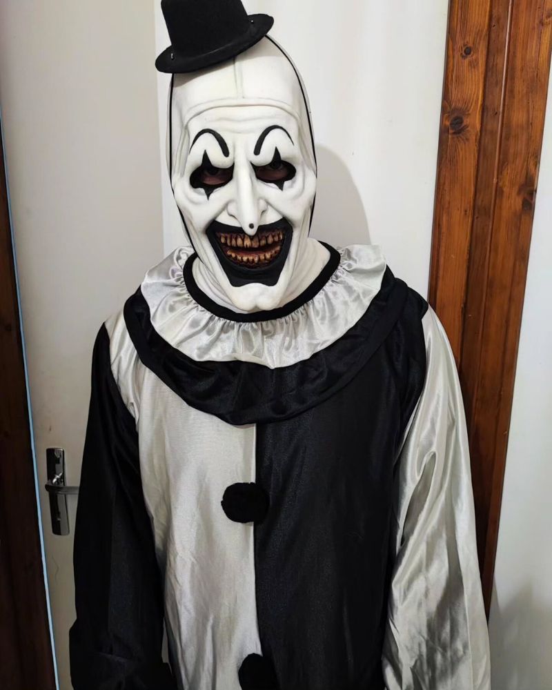 Art the Clown standing indoors in full costume, ready for a Halloween party night — The Terror Lab.