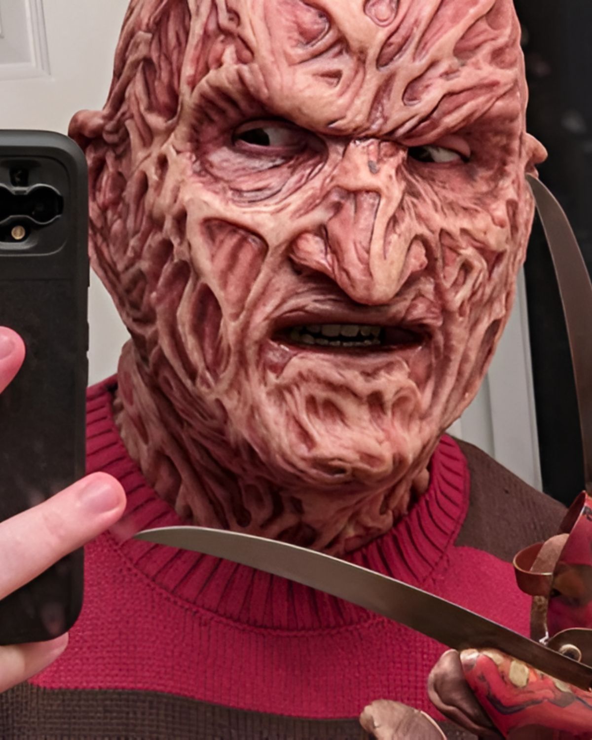 Freddy Krueger mask and claw glove worn by verified customer taking mirror selfie on Halloween night | The Terror Lab
