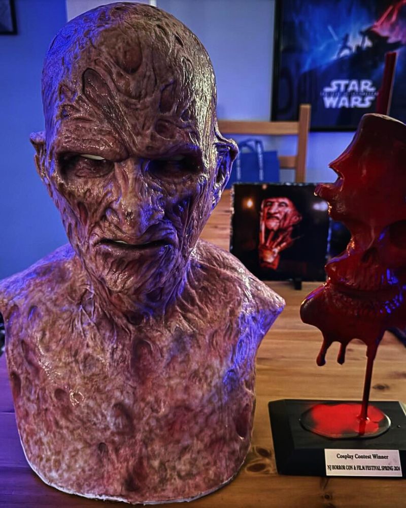Award-winning Freddy Krueger full mask on display with horror-themed lighting and trophy from NJ Horror Con Cosplay Contest – The Terror Lab