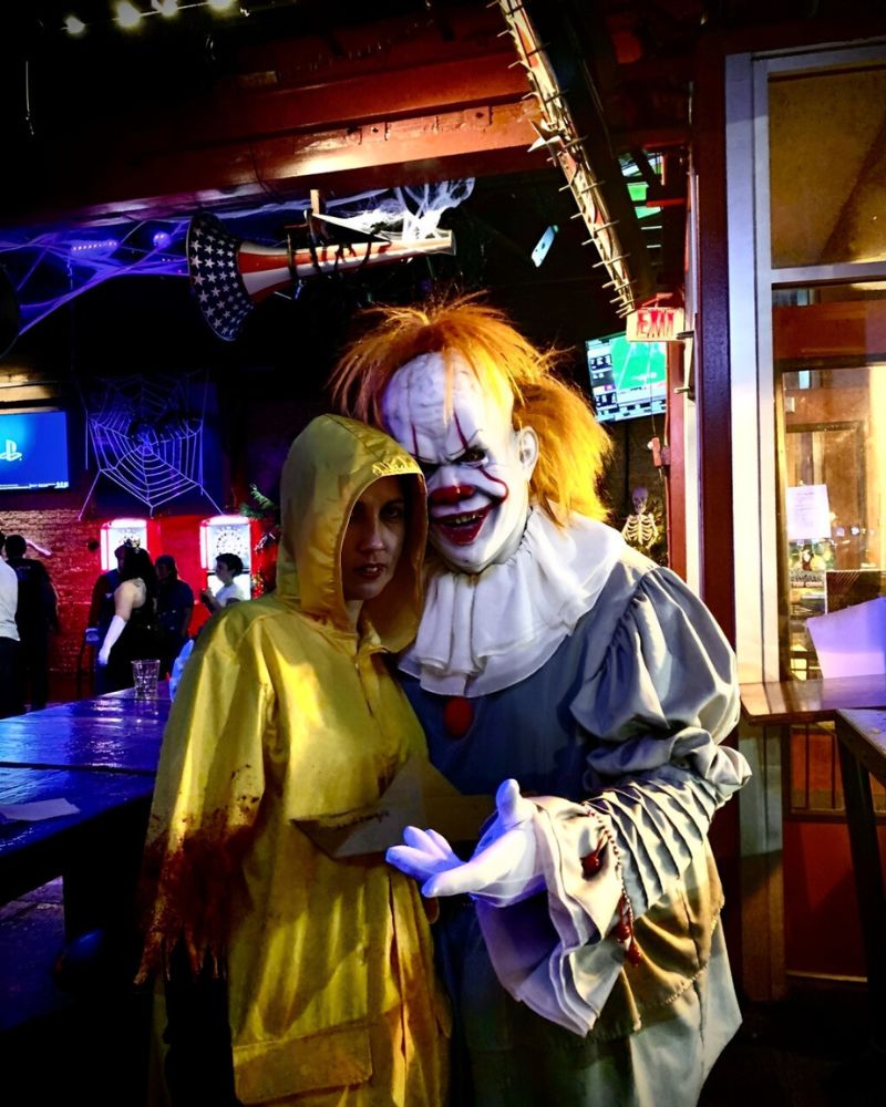 Pennywise clown mask and costume spotted at a Halloween night party with Georgie cosplayer in yellow raincoat — The Terror Lab