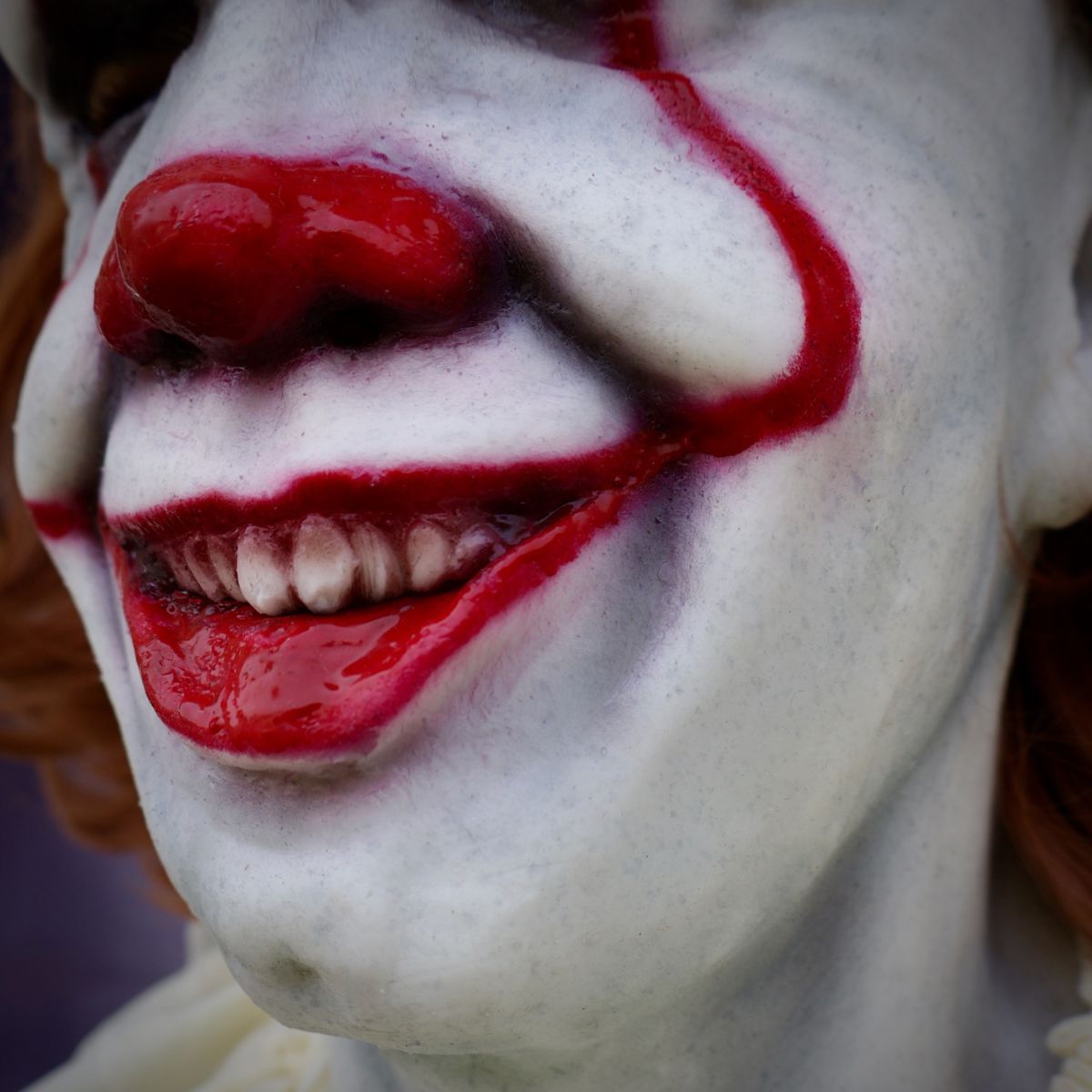Close-up of Pennywise Clown realistic mask with white face paint and red accents, from The Terror Lab