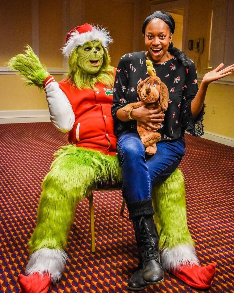 The Stealer of Christmas full costume and realistic mask spotted at a festive holiday party with a guest holding Max the dog — originally crafted for Halloween events — from The Terror Lab