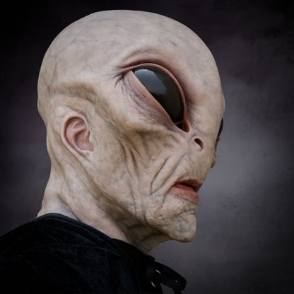 Close-up of an alien mask horror creature with a dark background