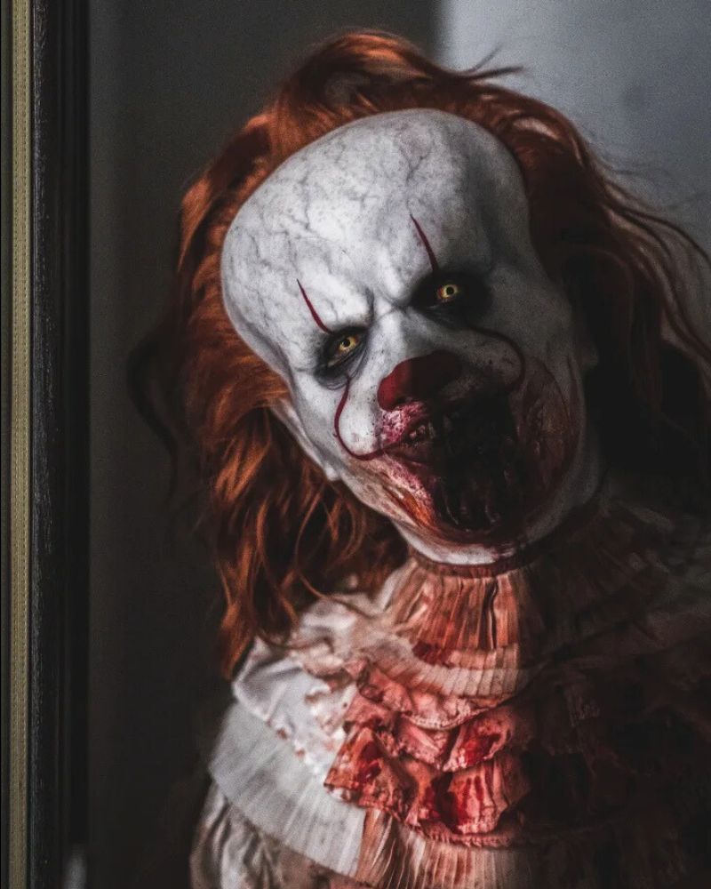 Realistic Pennywise mask with blood effects, spotted at Halloween party near dark hallway — The Terror Lab